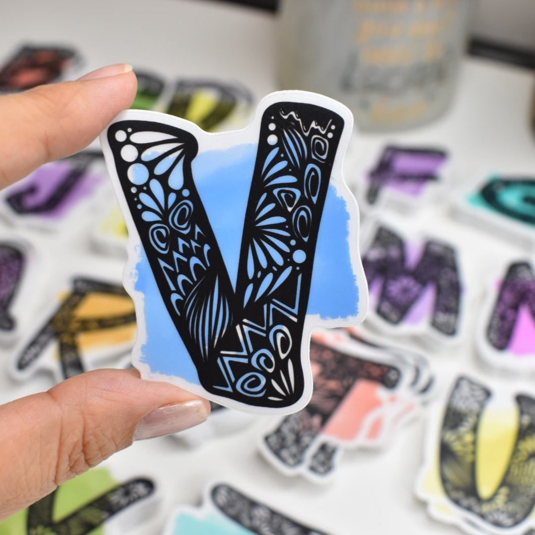 Letter “V” Clear sticker colored background