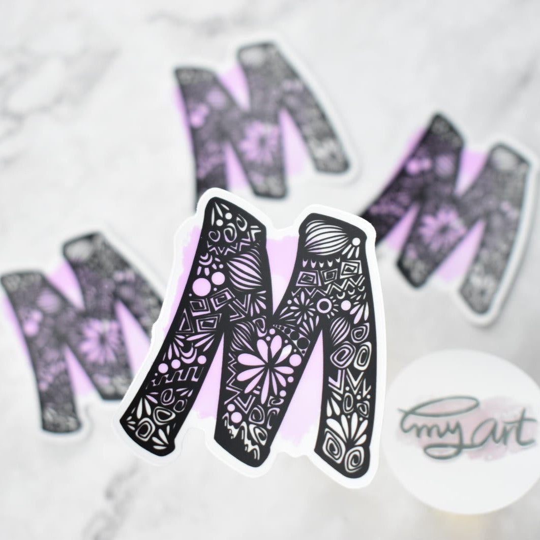 Letter “M”  Clear sticker colored Background